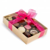 12 assorted chocolates in gold gift box with clear lid